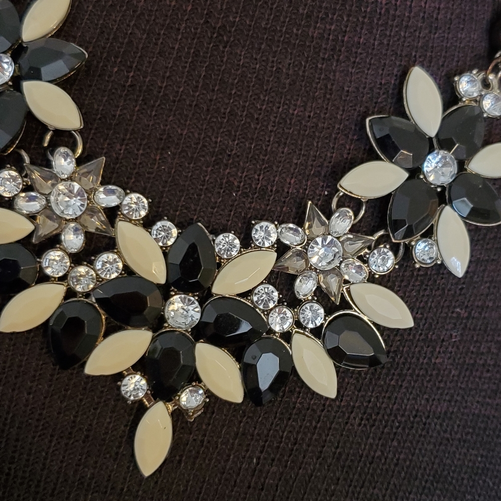 Gunmetal mesh bib statement necklace with black and cream flowers